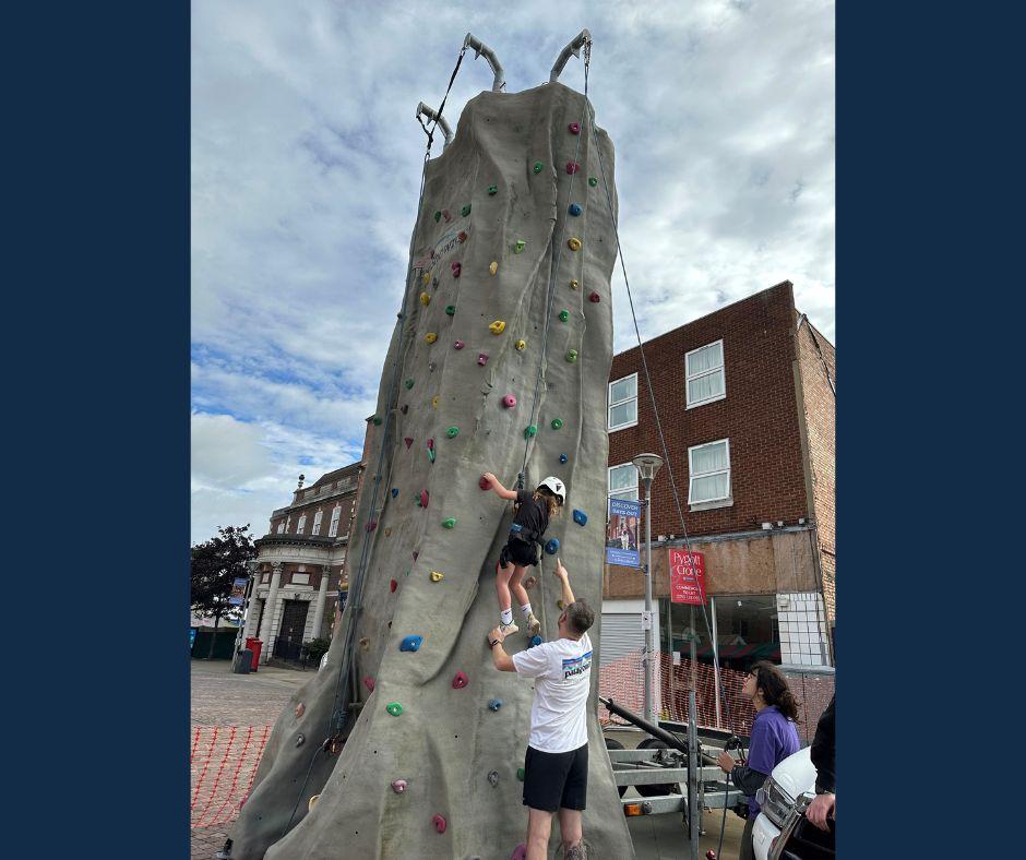 Climbing wall attraction a hit at market